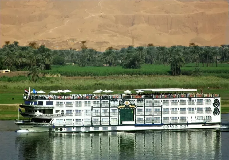 Sonesta St. George Nile Cruise by the riverbank – classic French‑style vessel sailing with refined charm