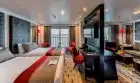 Elegant cabin aboard MS Mayflower Nile Cruise – plush bedding and panoramic river window
