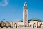 Modern cityscape of Casablanca, Morocco, featuring tall buildings and a clear blue sky.