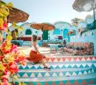 Traditional Nubian village with vibrant architecture and views of the Nile River
