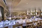 Dining area aboard Iberotel Crown Emperor Nile Cruise set for fine meals
