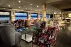 Luxurious cabin aboard MS Acamar Nile Cruise – plush bedding and panoramic window with Nile views