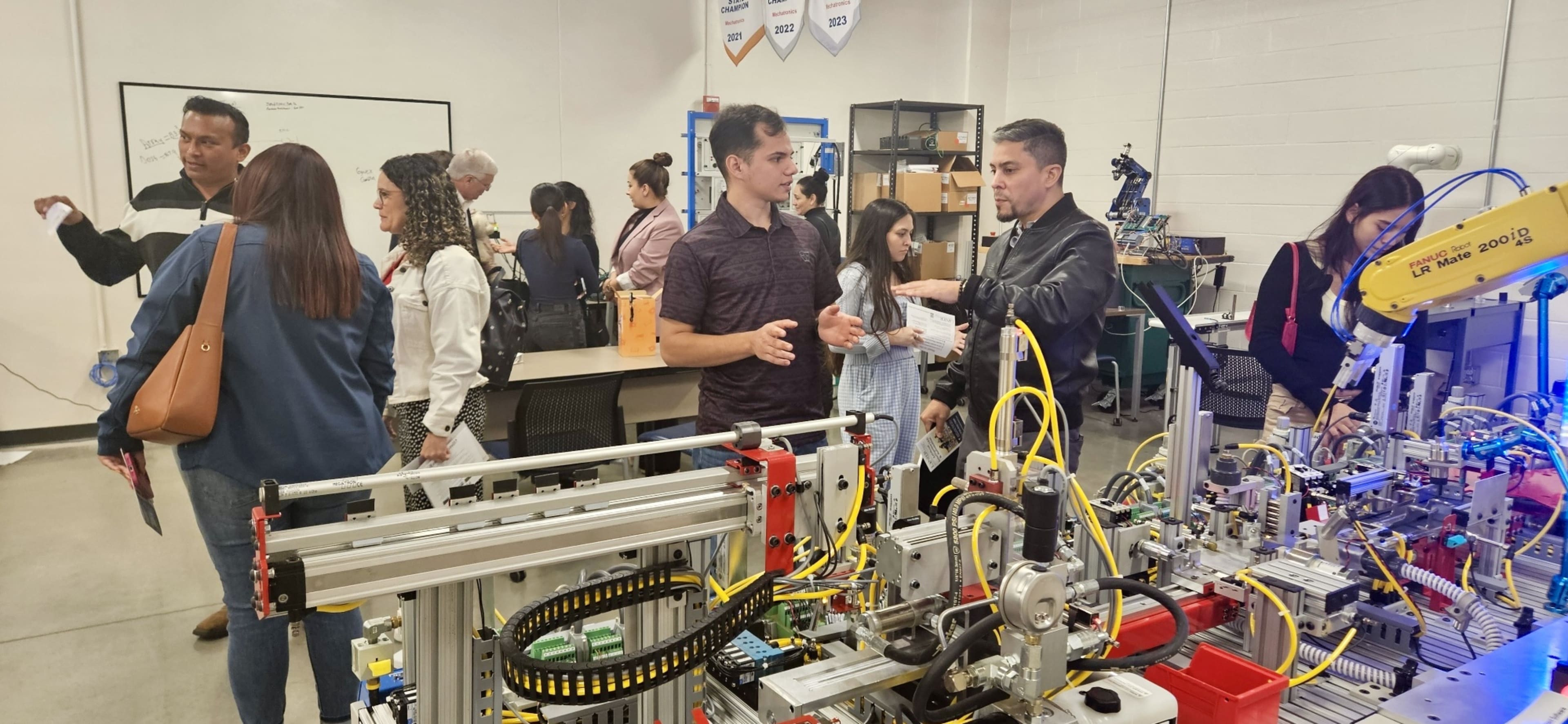 First National Staffing associates exploring mechatronics and robotics lab during Lanier Technical College facility tour
