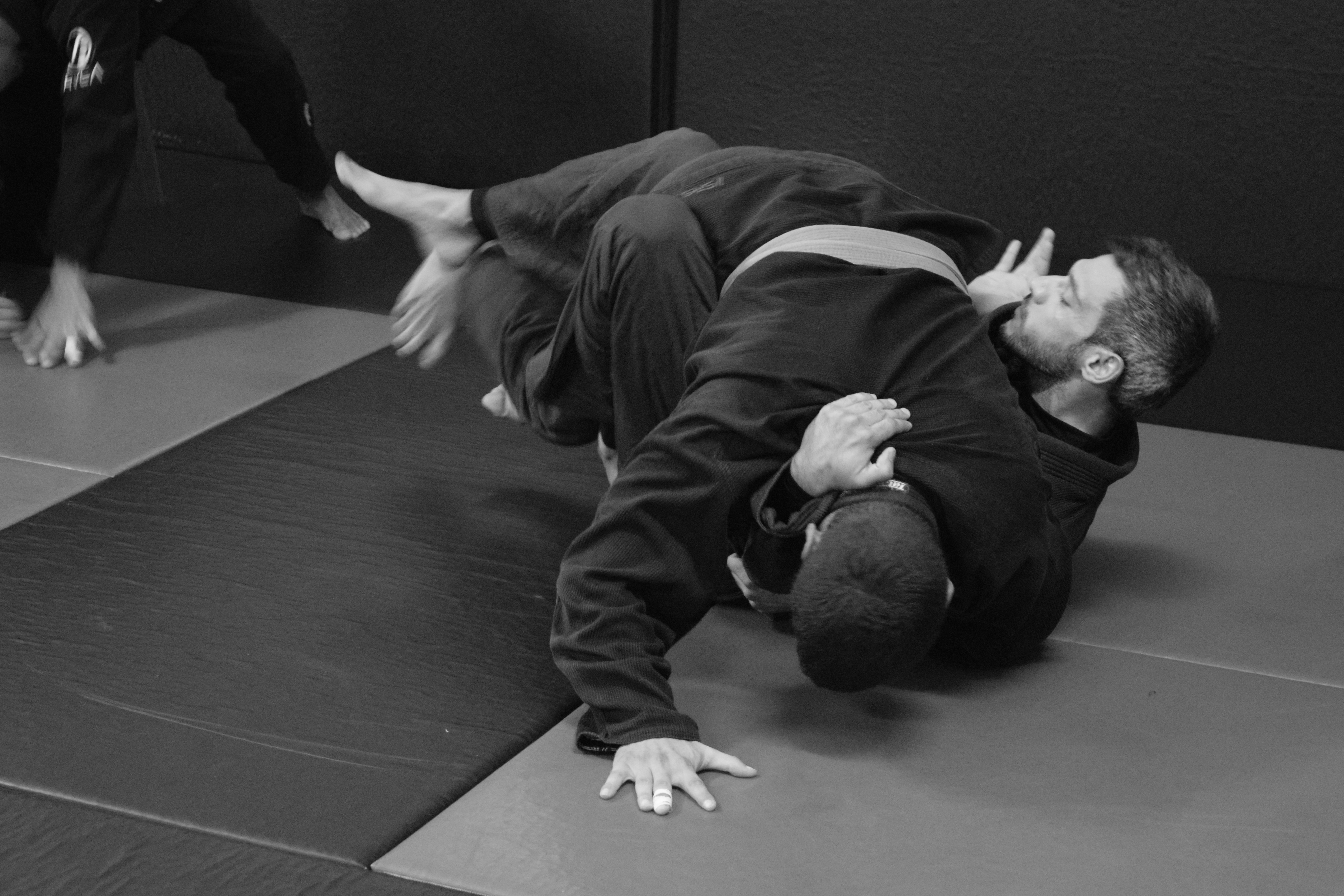 Female BJJ practitioner demonstrating a self-defense technique at our BJJ academy in Cyprus.