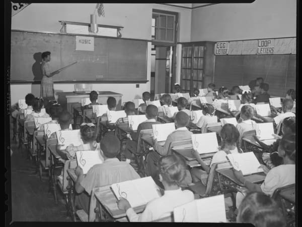 Children singing at Carr School