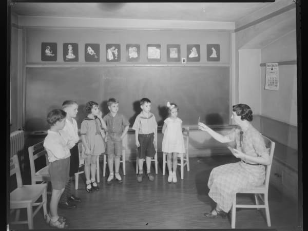 Deaf children with teacher at Central Institute for the Deaf