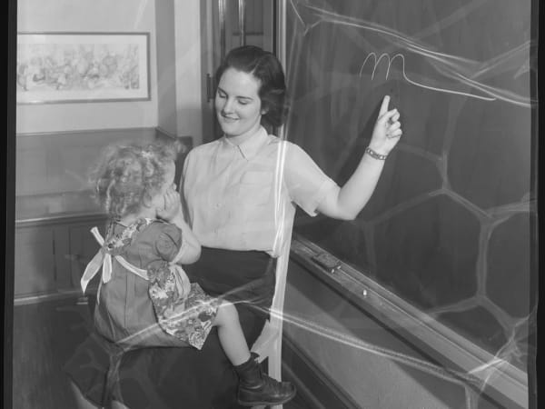 Deaf child with teacher at Central Institute for the Deaf