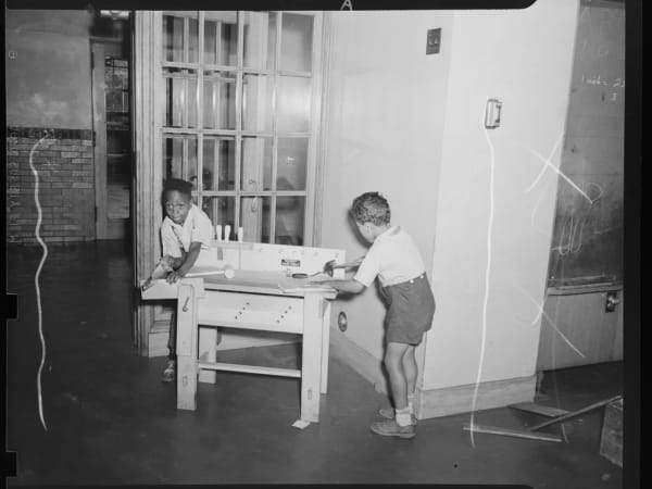 Kindergarten boys at a work bench, Cole School