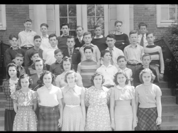Students posing in front of Nipher Middle School entrance
