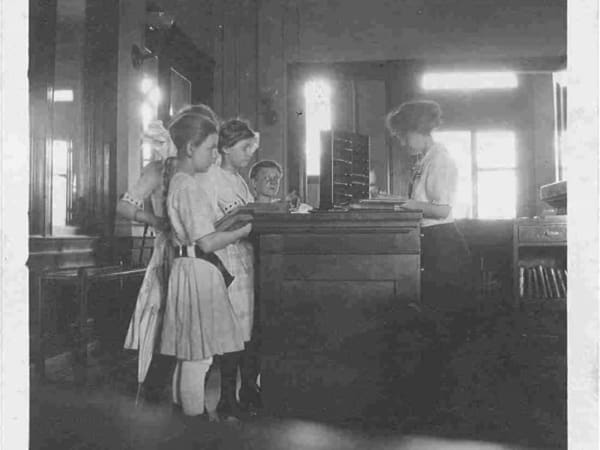 Patrons checking out books at Barr Branch Library