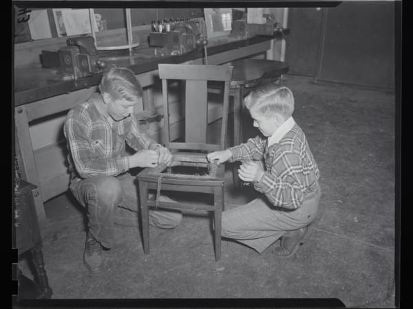 Buder School: Two Pupils Repairing an Old Chair