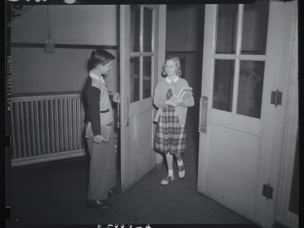 Blair School: Boy Opening Door for Girl