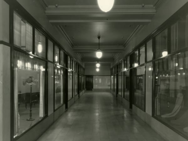 VIEW OF HALL WITH SHOP WINDOWS IN THE ARCADE BUILDING