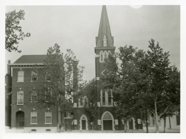 Unidentified Brick Church with Center Spire and Three Gothic Arch Entrance Ways. Probably St. Michael's Catholic Church Rectory. 2200 Eleventh.