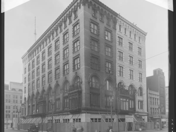 Exterior view of the Edison Brothers Stores Building during cleaning, 400 Washington Avenue.