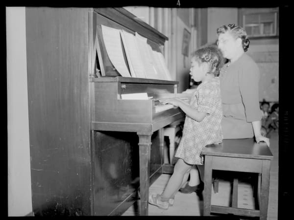 Simmons School: Kindergarten Parents' Meeting - Girl Singing at Piano
