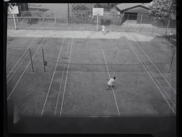Blewett High School: Two Young People Playing Tennis