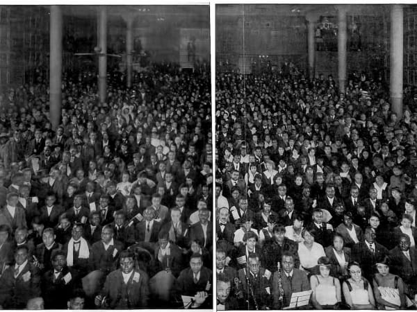 Midnight Audience at the Booker T. Washington Theatre, St. Louis — the auditorium filled for a midnight show, with the house orchestra in the foreground (patrons holding American flags, a WWI-era touch)