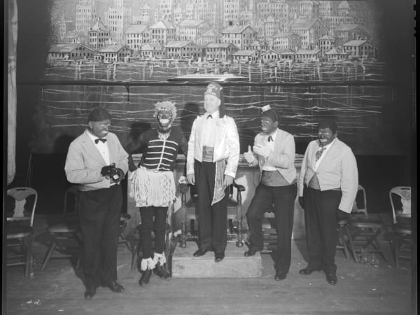 GROUP PORTRAIT OF MEN DRESSED AS MINSTRELS POSING WITH A SHRINER THE MOOLAH TEMPLE.