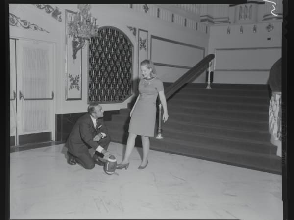 St. Louis Cardinals Football Player and Woman Posing with a Football at the Powell Symphony Hall