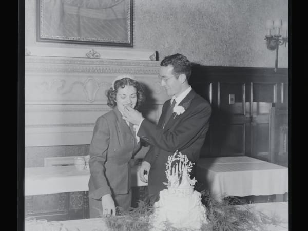 Groom Feeding Wedding Cake to the Bride at the Saum Hotel