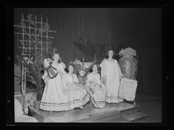 PEOPLE POSING FOR PHOTOGRAPHS IN COSTUME AT CONCORDIA TURNER HALL.
