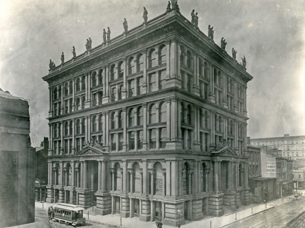 The building from Sixth and Locust with its rooftop statues, a horsecar at the corner. Copy of a photograph inscribed St. L. Mutual Life Bld. 1875.
