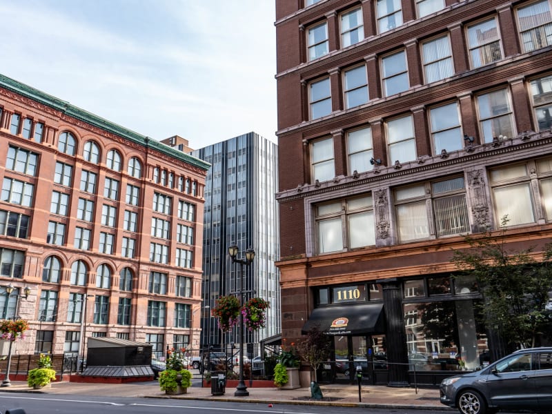 Rice-Stix Dry Goods Company Warehouse, 1015 Locust St: Looking along Washington Avenue: the Rice-Stix building at 1000–98 Washington, the 1015 Locust warehouse behind it, and the Catlin-Morton Buildings at 1110–20 Washington.