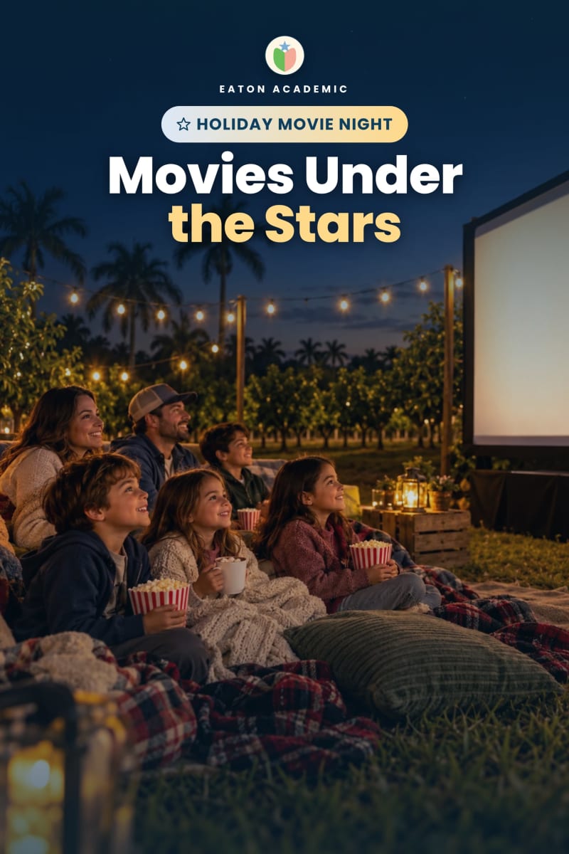 Movies Under the Stars, an Eaton Academic holiday movie night: families wrapped in plaid blankets hold popcorn and hot cocoa as they watch a big outdoor screen under string lights among the groves at night.