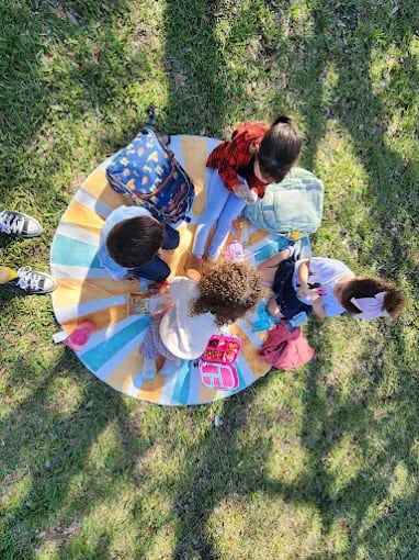 Kendall microschool students exploring nature in a hands-on outdoor lesson
