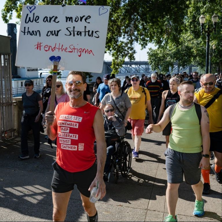 people holding signs in a march