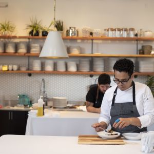 A chef prepares a dish for a dinner during Feast Portland, the culinary celebration held every September.