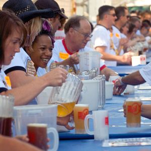 Volunteers pour beer at the Oregon Brewers Festival, held every July on Portland\'s waterfront.