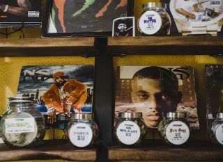 Hip-hop records and jars of rapper-themed cannabis decorate Green Hop Dispensary.