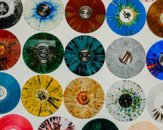 multi-colored records hanging on a wall