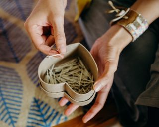 a box of porcupine quills for jewelry making
