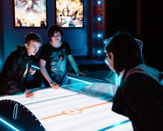air hockey match at Avalon Theatre & Wunderland