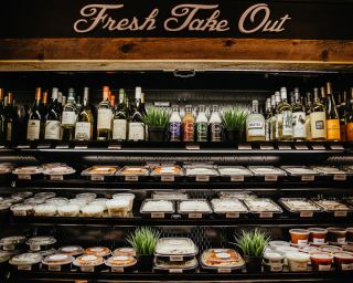 shelves stocked with food and drinks at Amalfi's mercato