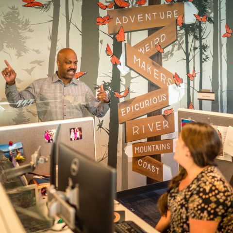 Travel Portland\'s modern, open office includes lots of natural light and features like murals by local artists.