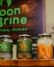 A row of jars of fermented vegetables (including carrots, pickles and beets) from the Portland pickle brand MoonBrine.