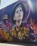 A mural painted outside vintage shop Artifact on Southeast Division Street.