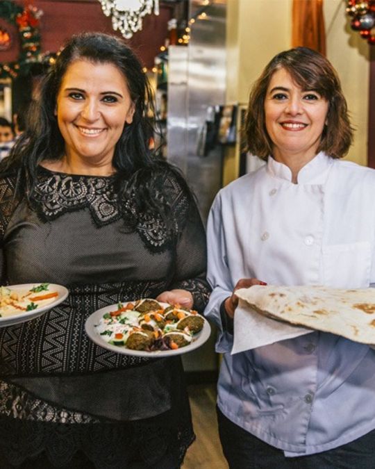 Sisters Hilda Dibe (left) and Chef Mirna Attar (right) share Lebanese dishes.