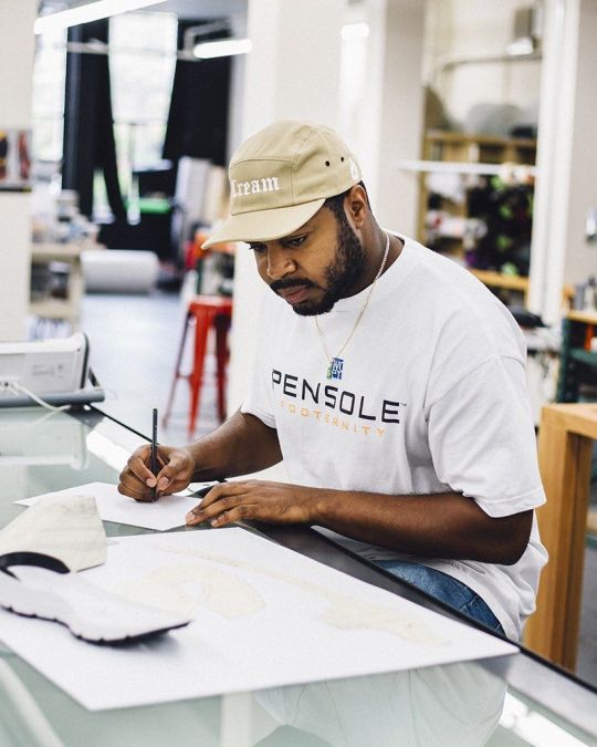 SneakerWeek founder Herbert Smith works on a new shoe design.