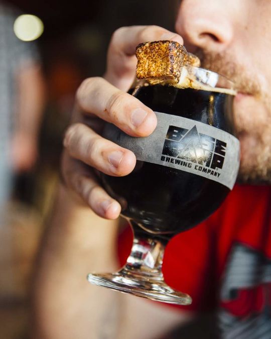 Sip a marshmallow-topped S\'mores Stout at Base Camp Brewing.