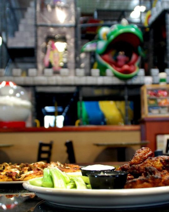 Parents can nosh on wings and other snacks as kids explore PlayDate PDX\'s three-story castle.