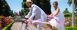 Newlyweds ride a tall tandem bike during Pedalpalooza