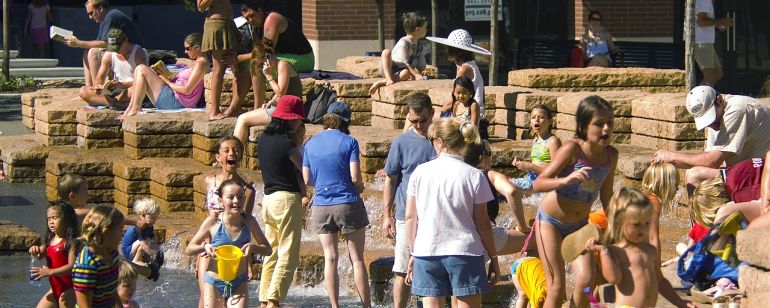 Kids play in the fountain at Jamison Square in the Pearl District.