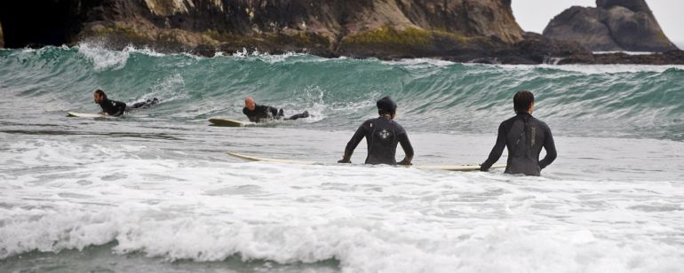 Surfers catch the waves at Oswald West State Park on the Oregon Coast.