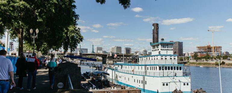 The Oregon Maritime Museum, housed in an historic steam-powered, sternwheel ship-assist tugboat, is permanently moored in the Willamette River by Tom McCall Waterfront Park.
