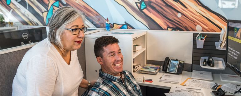 Travel Portland\'s modern, open office includes lots of natural light and features like murals by local artists.